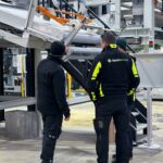 Black Donuts engineers inspecting tire plant equipment during brownfield upgrade without downtime.